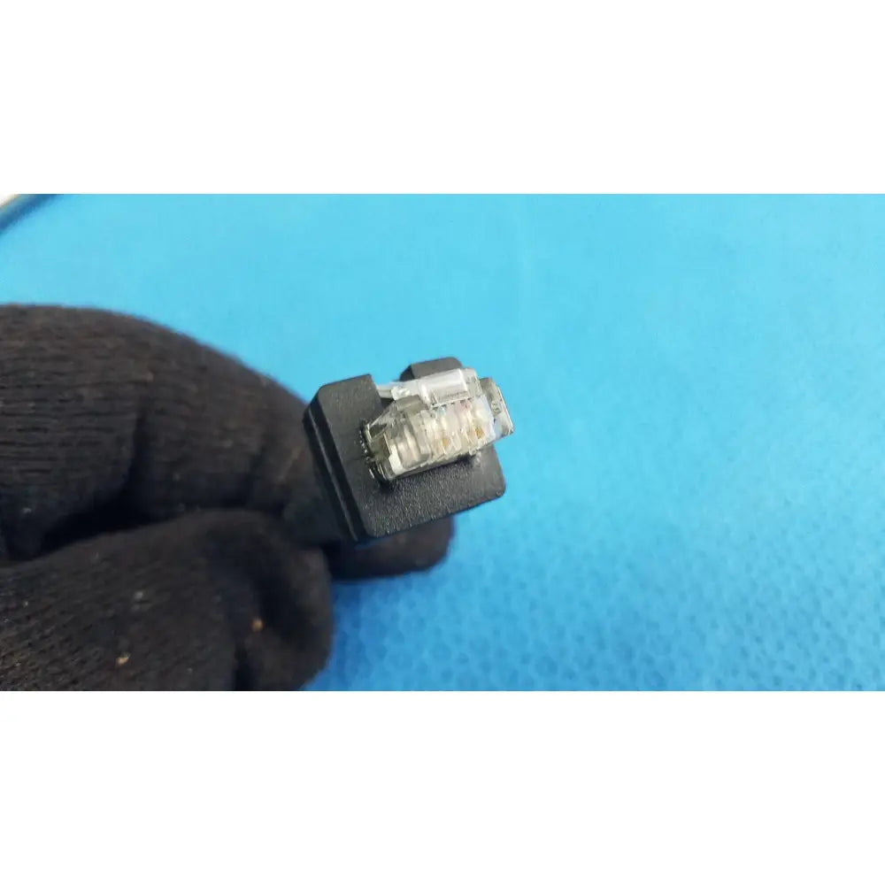 Black usb-a connector with transparent housing showing metallic contacts for barcode scanner pen reuse medical device