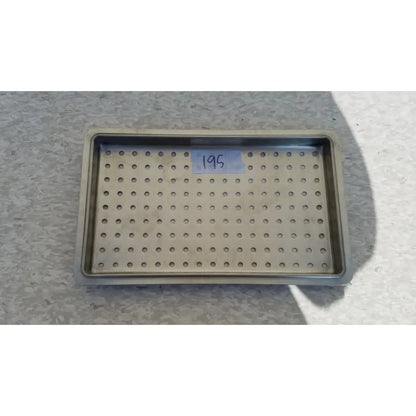 Rectangular stainless steel tray with circular holes for 1 layer of instrument sterilization case use