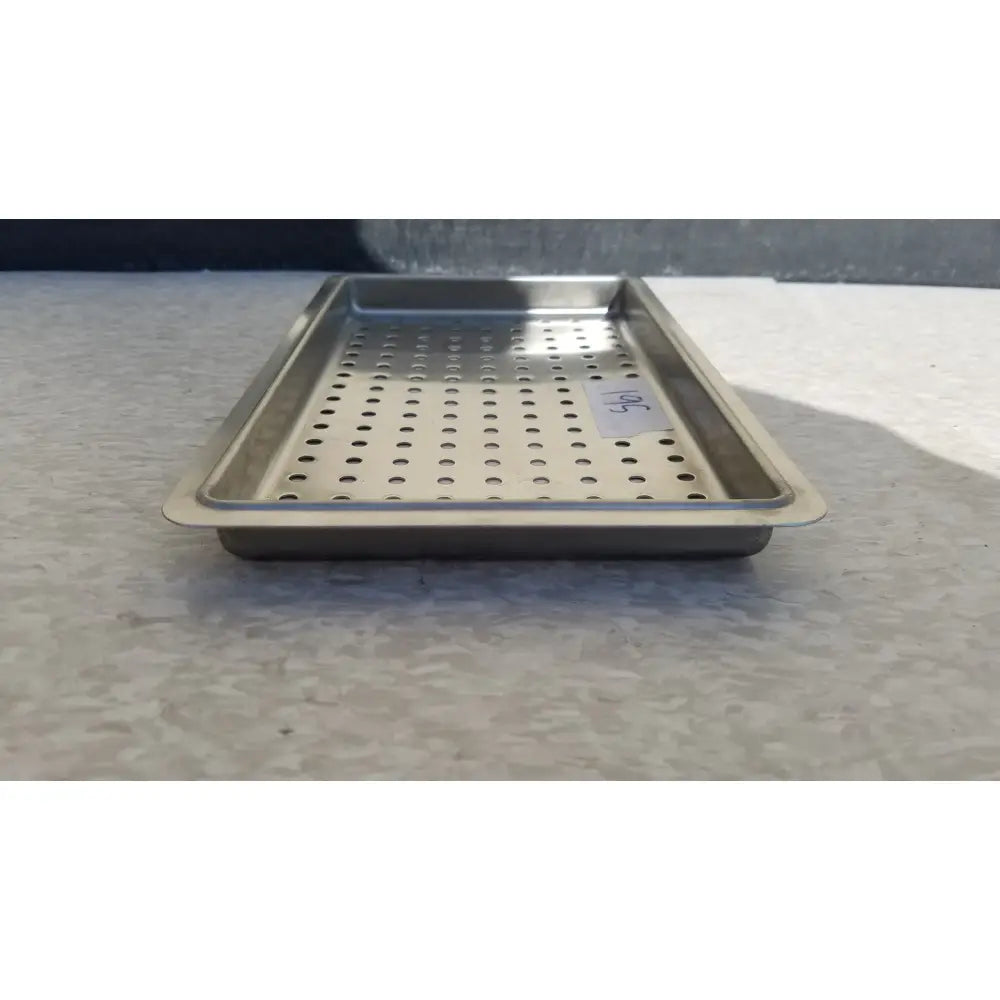 Rectangular stainless steel perforated tray with raised rim for 1 layer of tray in instrument sterilization case