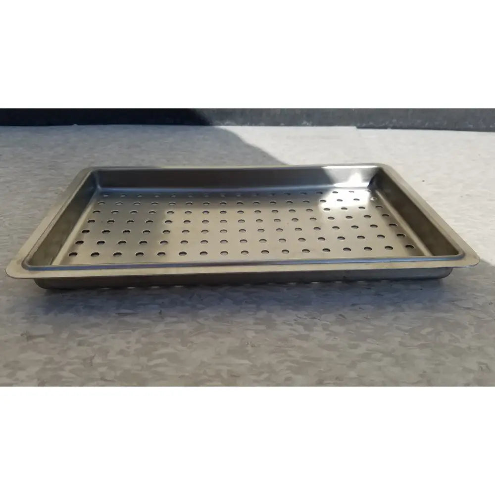 Rectangular stainless steel tray with perforations for one layer of instrument sterilization case use