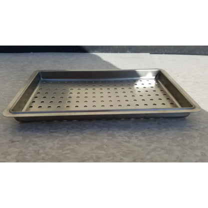 Rectangular stainless steel tray with perforations for one layer of instrument sterilization case use
