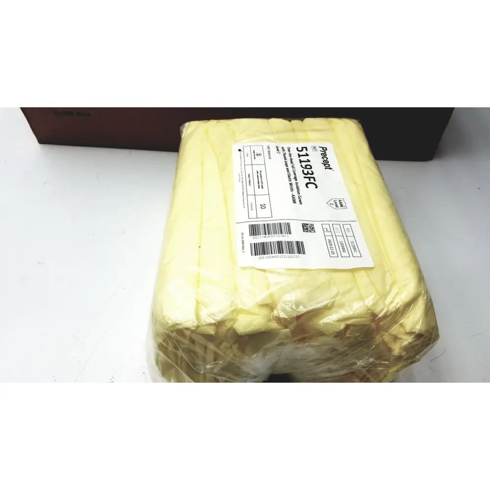 A package of yellow microfiber cleaning cloths wrapped in plastic with a label for 100 count precept medical isolation gowns