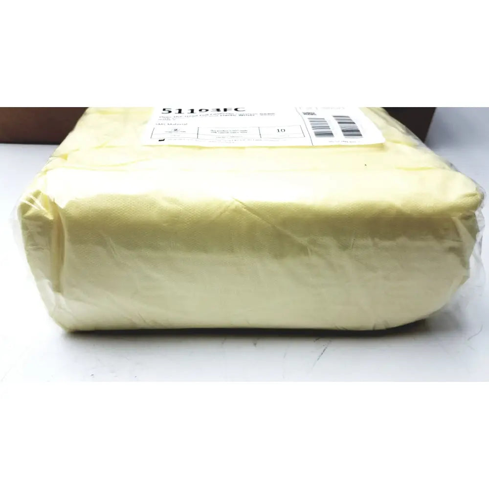 A pale yellow rectangular package wrapped in clear plastic containing 100 count precept medical isolation gowns