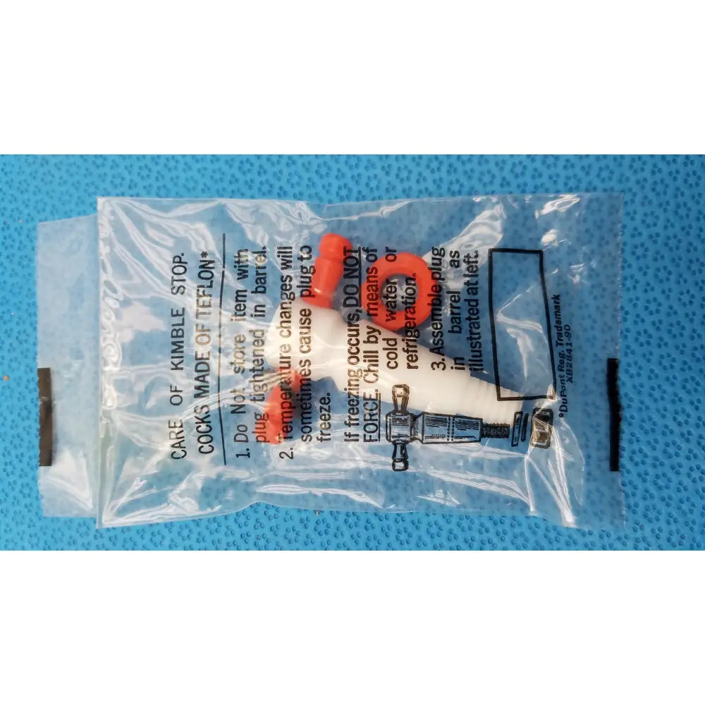A clear plastic package containing an orange and white teflon kimble stopcock for 1000ml kimax separatory funnel glass