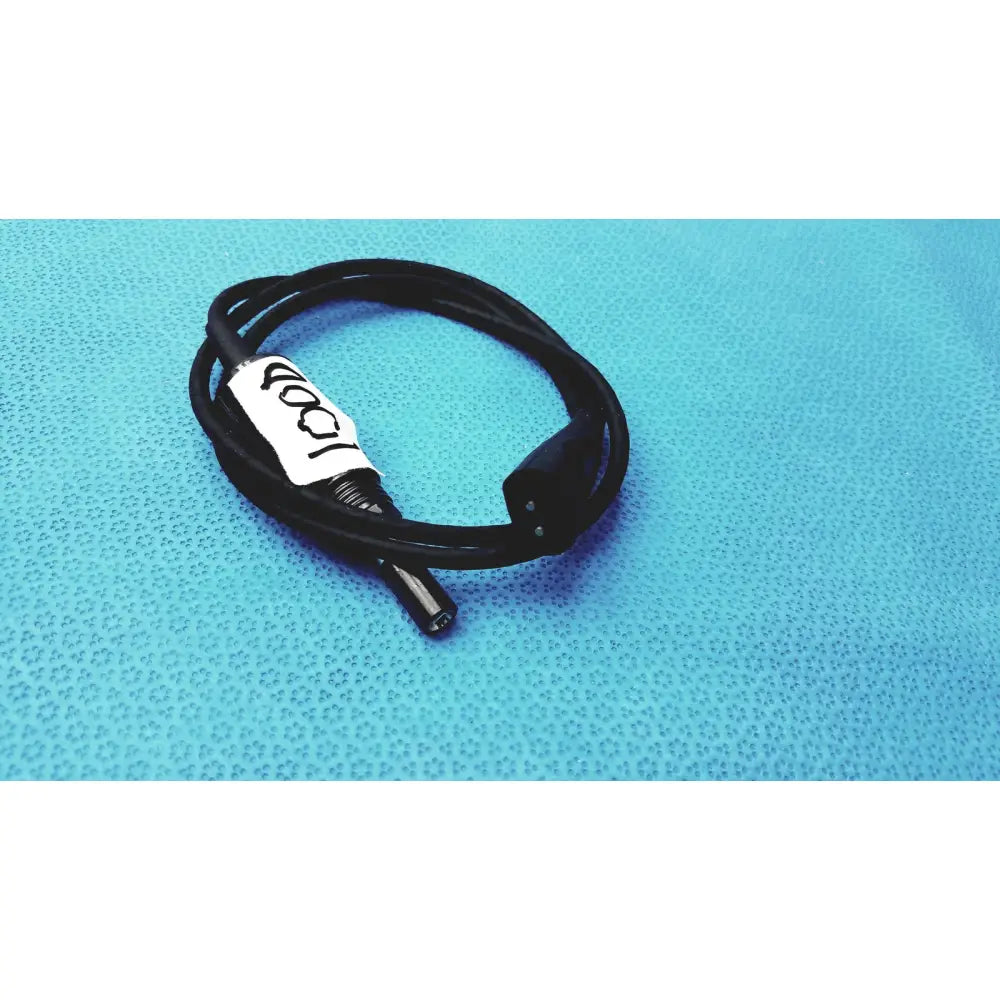 Black coiled 100cm smartwatch charging cable with safety protection features and two black connectors with white label 100