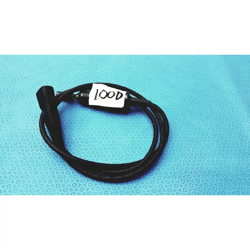 Black coiled 100cm smartwatch charging cable with metallic connector and safety protection features labeled lood