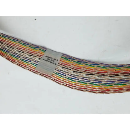 A colorful 12 pin female cable harness with braided insulated wires and a label indicating made in mexico
