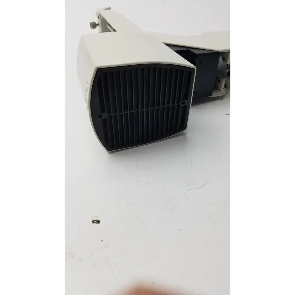 Off-white industrial speaker with black grille showing internal components paired with 12v 100w leica lamp arm for inverted microscope use