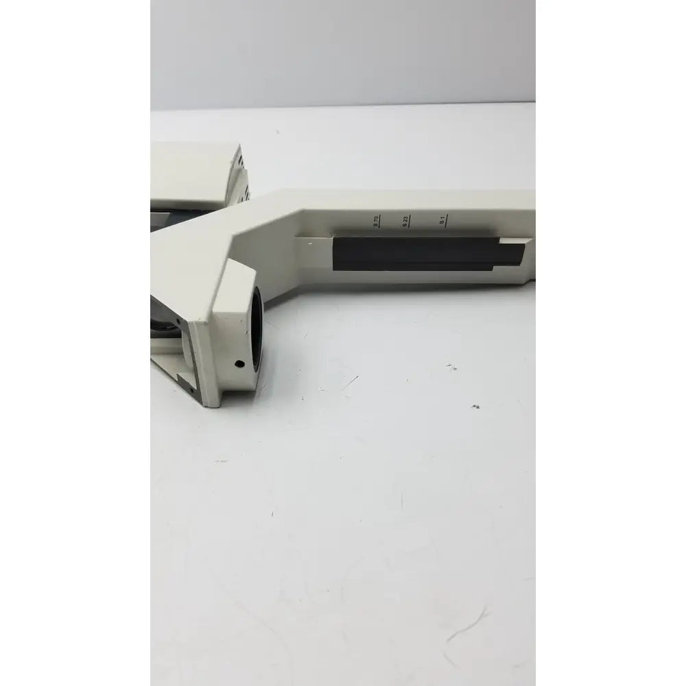Off-white plastic microscope stage with black markings and rectangular cutout for 12v 100w leica lamp arm use