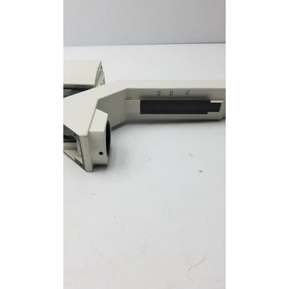 Off-white plastic microscope stage with black markings and rectangular cutout for 12v 100w leica lamp arm use