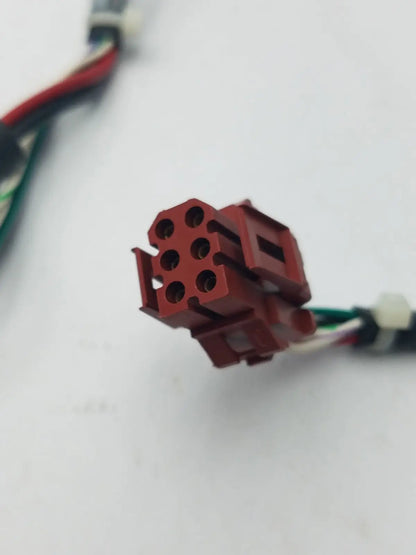 Red plastic 14 pin female connector with six circular openings and rectangular housing for cable harness and wire connector cable