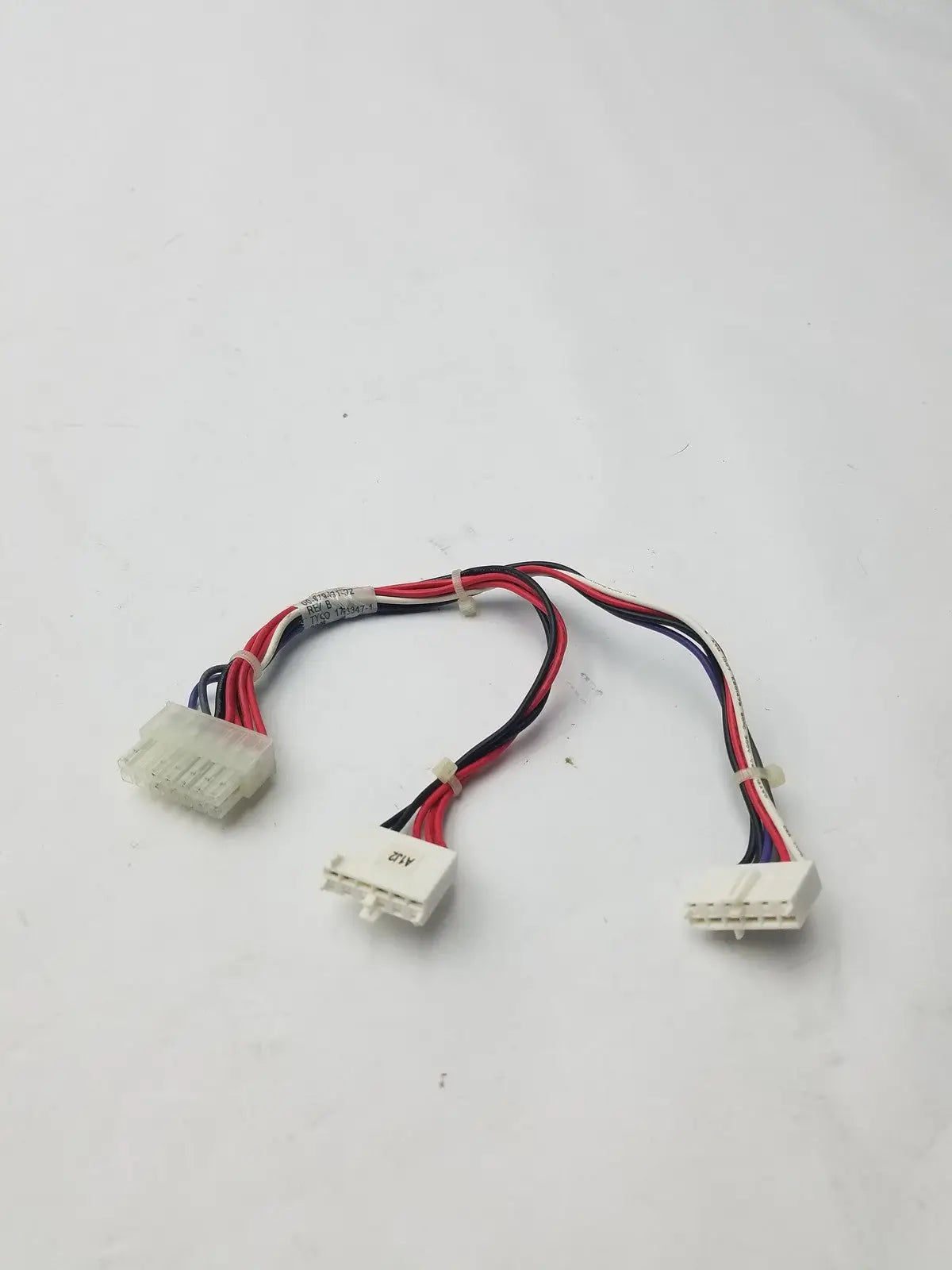 White plastic 14 pin female connector cable harness with red black and blue wires for electrical connections