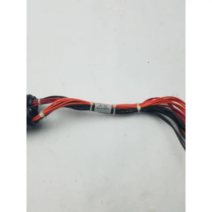 A bundle of red and black wires with a white label in a 16 pin female to pin male wire harness equipment cable