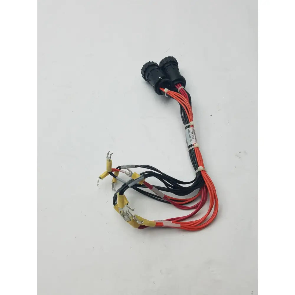 Black and red insulated 16 pin female to pin male wire harness with two black connectors and exposed metal terminals bundled by white ties
