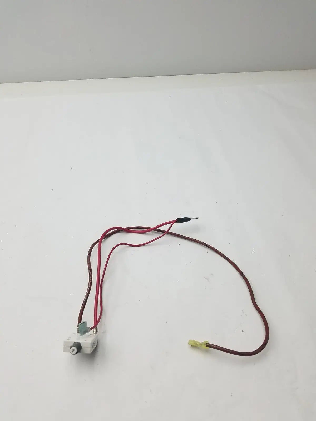 White plastic 70a microswitch with red and brown wire leads model g-bbde6-60e for electrical control applications