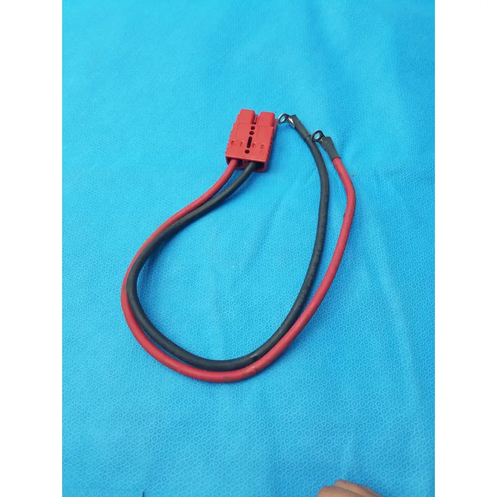 Red and black insulated 175A-800V battery charging connector cable with a red plastic connector for battery charging use