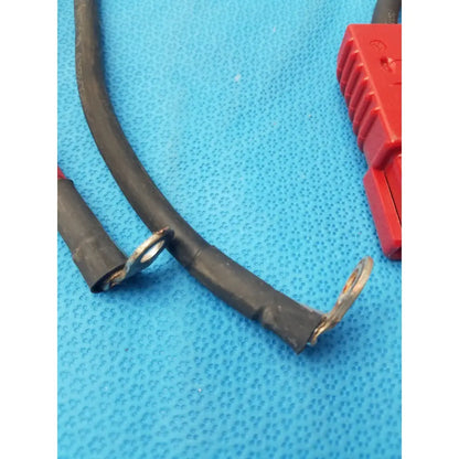 Black insulated 175A-800V battery charging connector cable with exposed metal ring terminals for battery charging