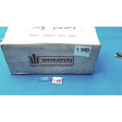 1ml clear glass ampoule made of low borosilicate with a narrow neck and rounded body labeled 7 q143