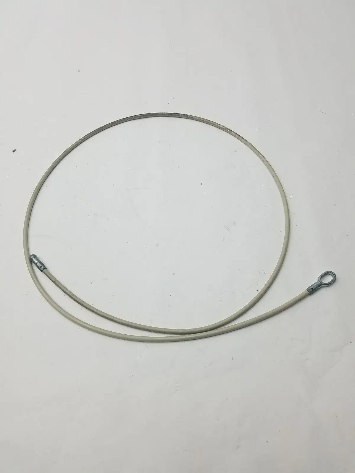A coiled gray insulated 2 different sided cable with metal connectors for g-bbdf6-59n applications