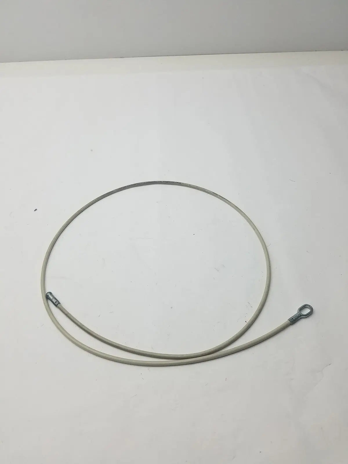 A coiled gray insulated 2 different sided cable with metallic connectors g-bbdf6-59n for versatile connections