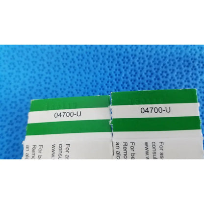 Green and white labeled boxes of welch allyn 2 pack replacement lamp bulb allyn 04700-u with code 04700-u printed