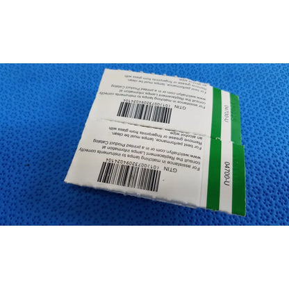 White and green rectangular packaging with barcode labels showing welch allyn allyn 04700-u replacement lamp bulb product information