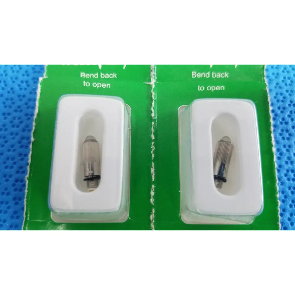 Two silver metal cigarette lighter igniters in white blister packs on green backing for welch allyn 04700-u replacement lamp bulb