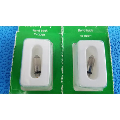 Two silver metal cigarette lighter igniters in white blister packs on green backing for welch allyn 04700-u replacement lamp bulb