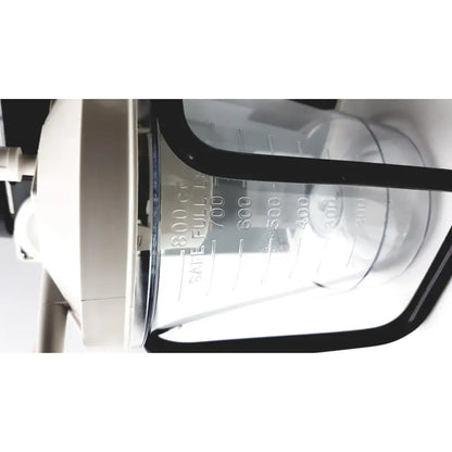 Clear plastic measuring cup with black rim and white volume markings up to 800 cc for precision medical easy aspirator