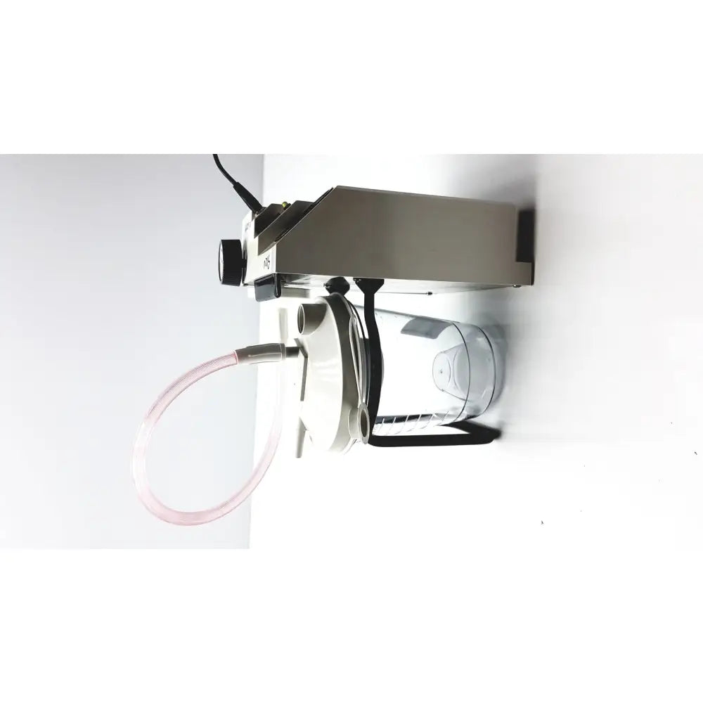 Stainless steel precision medical easy go vac aspirator with clear plastic container and pink tubing for medical suction