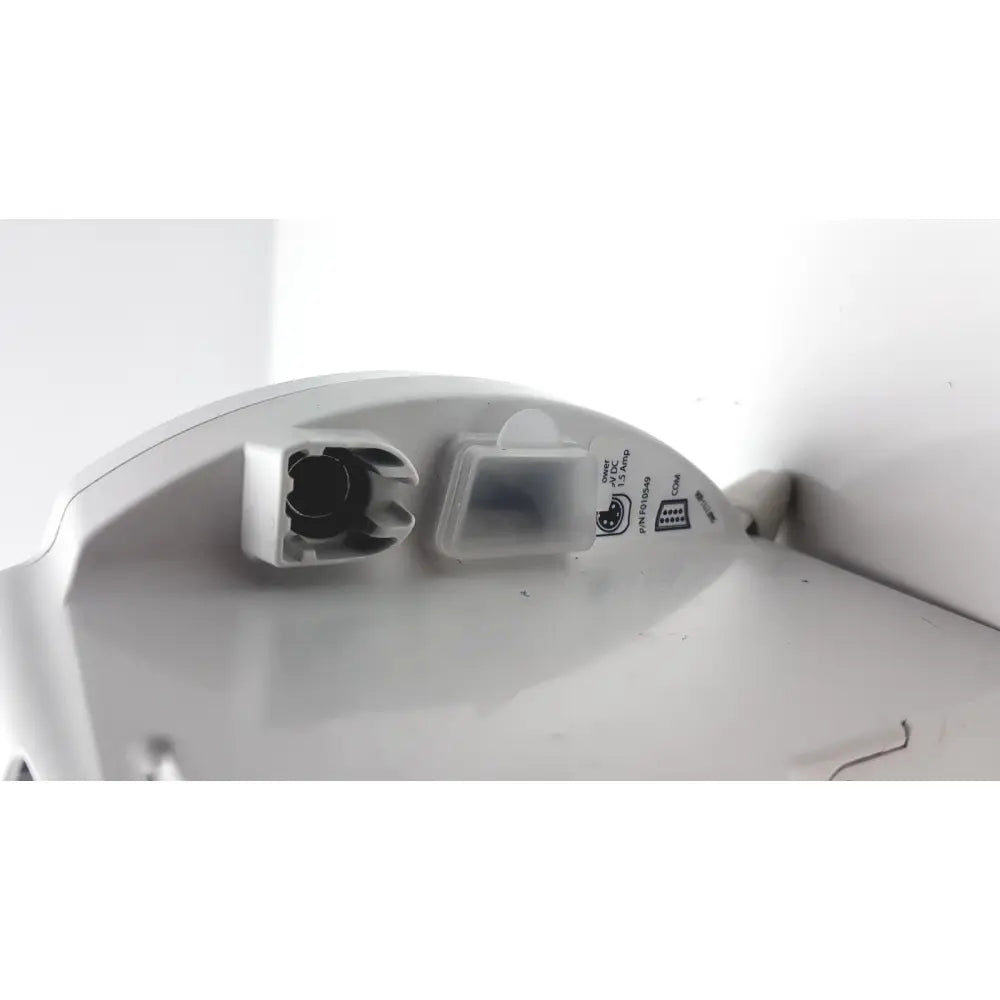 White plastic base of covidien kangro epump with integrated charging port and small transparent compartment back side
