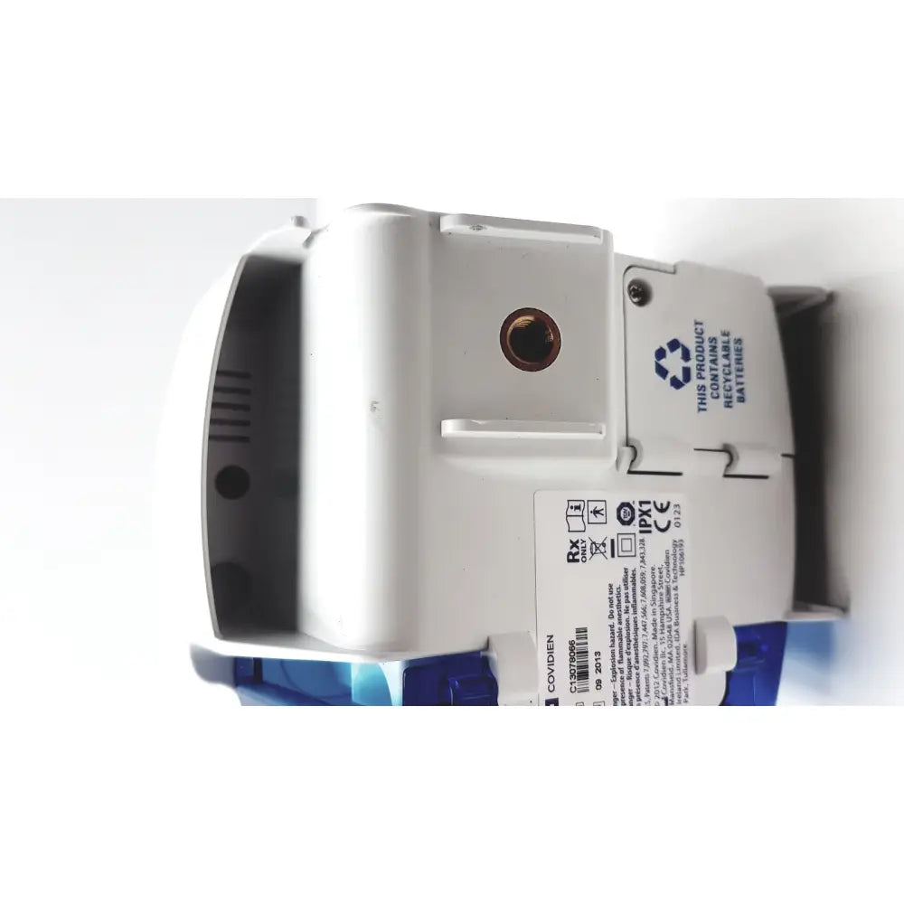 White and blue plastic medical device with circular port on top covidien kangro epump serial c13078066 from 2013