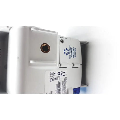 White plastic wall-mounted covidien kangro epump with brass circular port and recycling label serial c13078066 back side