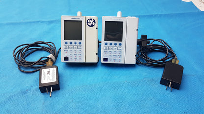 Lot of 2 Baxter Sigma Spectrum Infusion Pumps With AC Power Adapters P/N 35162