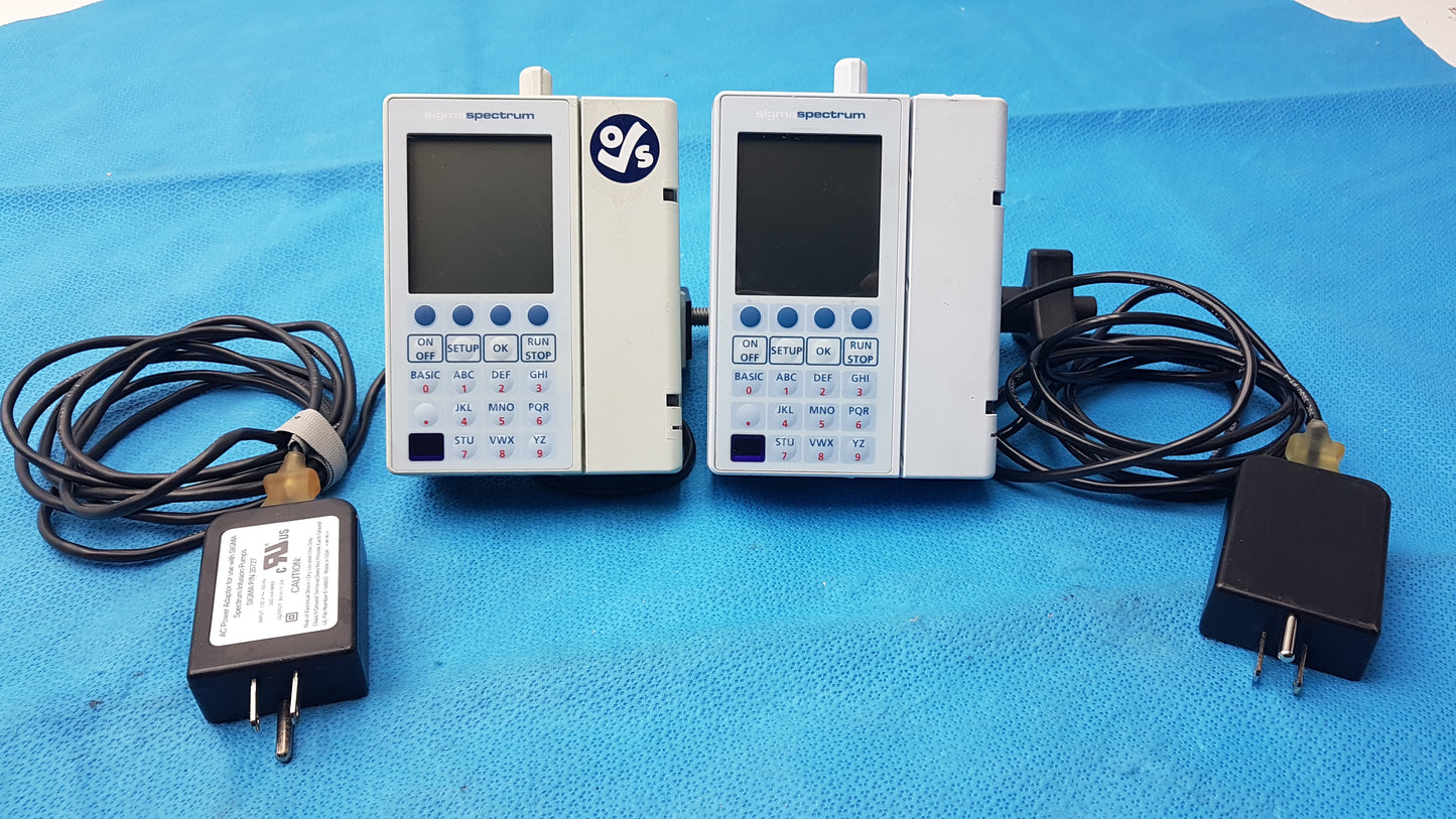 Lot of 2 Baxter Sigma Spectrum Infusion Pumps With AC Power Adapters P/N 35162