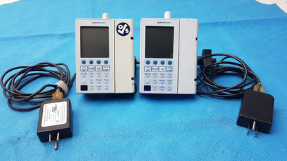 Lot of 2 Baxter Sigma Spectrum Infusion Pumps With AC Power Adapters P/N 35162