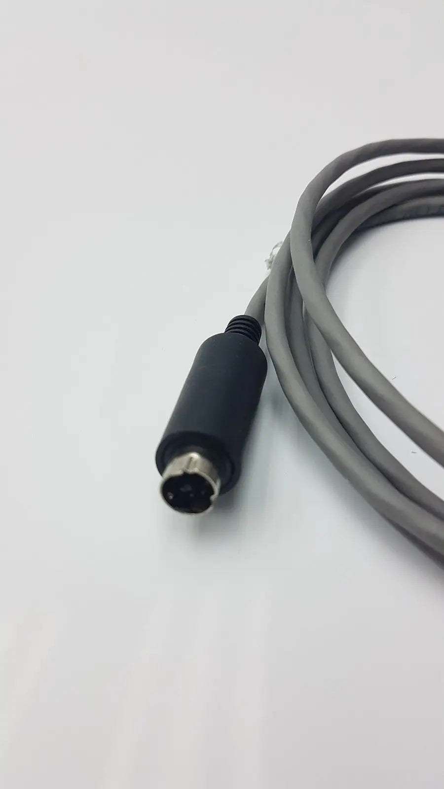 Gray coiled 10 pin cable with black connector and metallic circular plug for medical cable g-bbdd1-32r 2201564