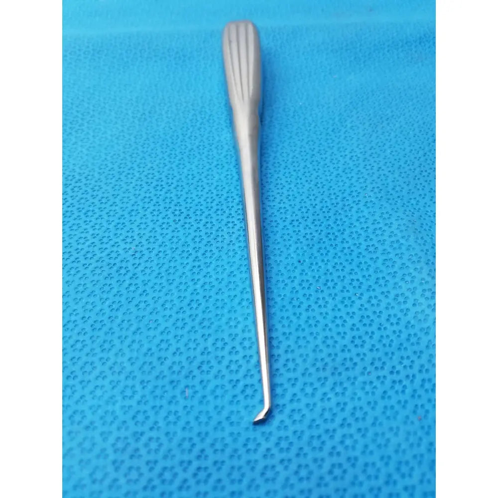 Silver spratt bone curette stainless surgical orthopedic instrument with textured ribbed handle and slender curved tip