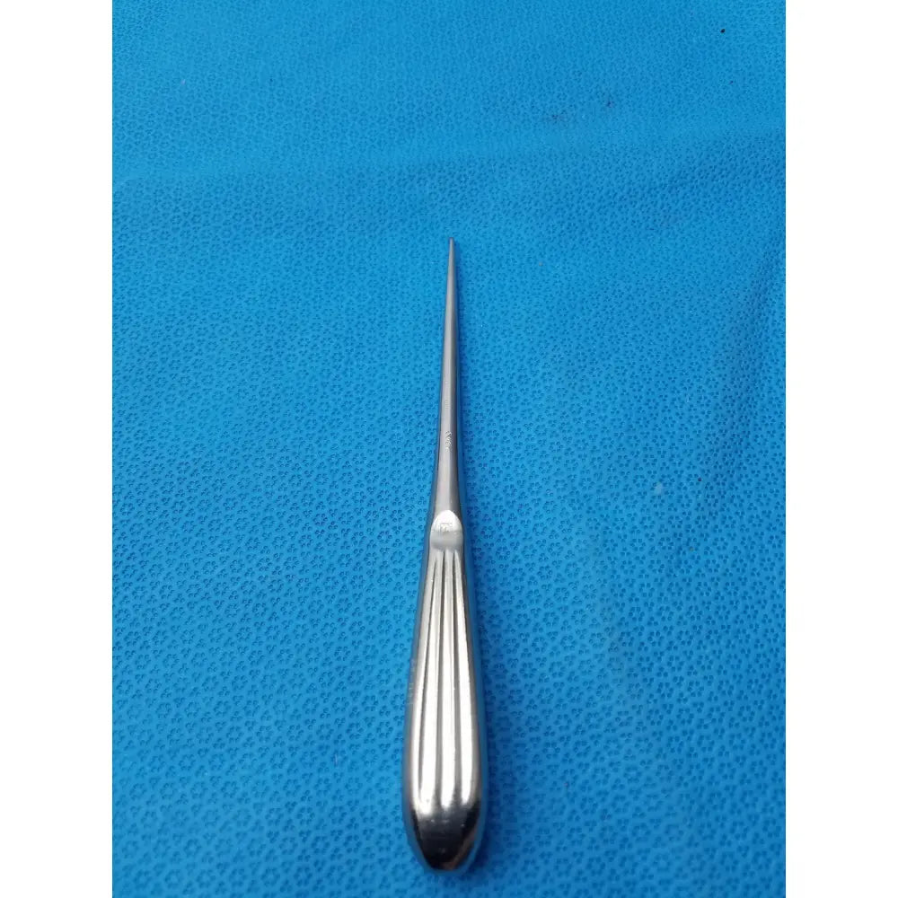 Silver spratt bone curette stainless surgical instrument with slender pointed tip and ribbed handle for orthopedic use