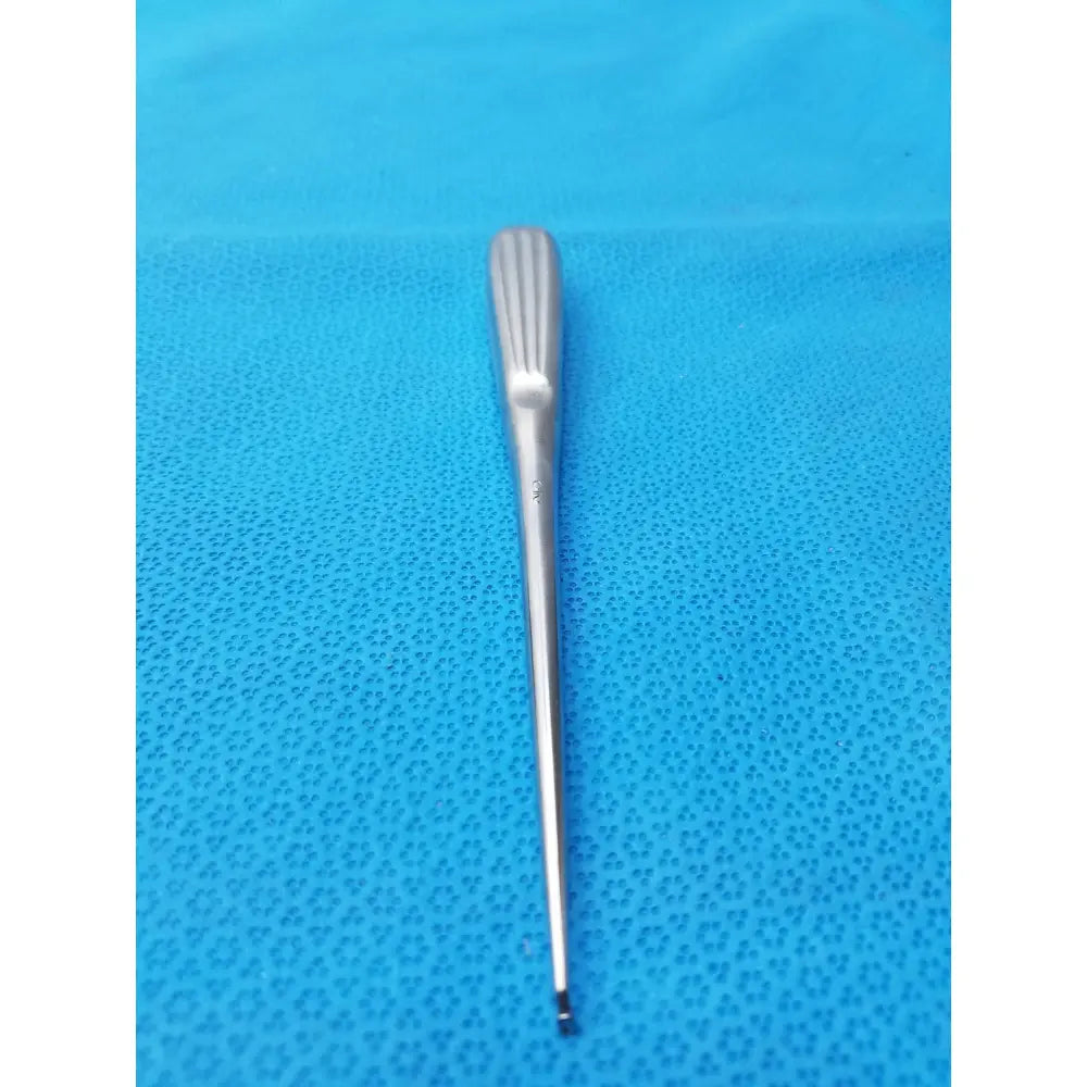 A sleek stainless bone curette spratt bone curette with ribbed handle and tapered shaft for surgical orthopedic use