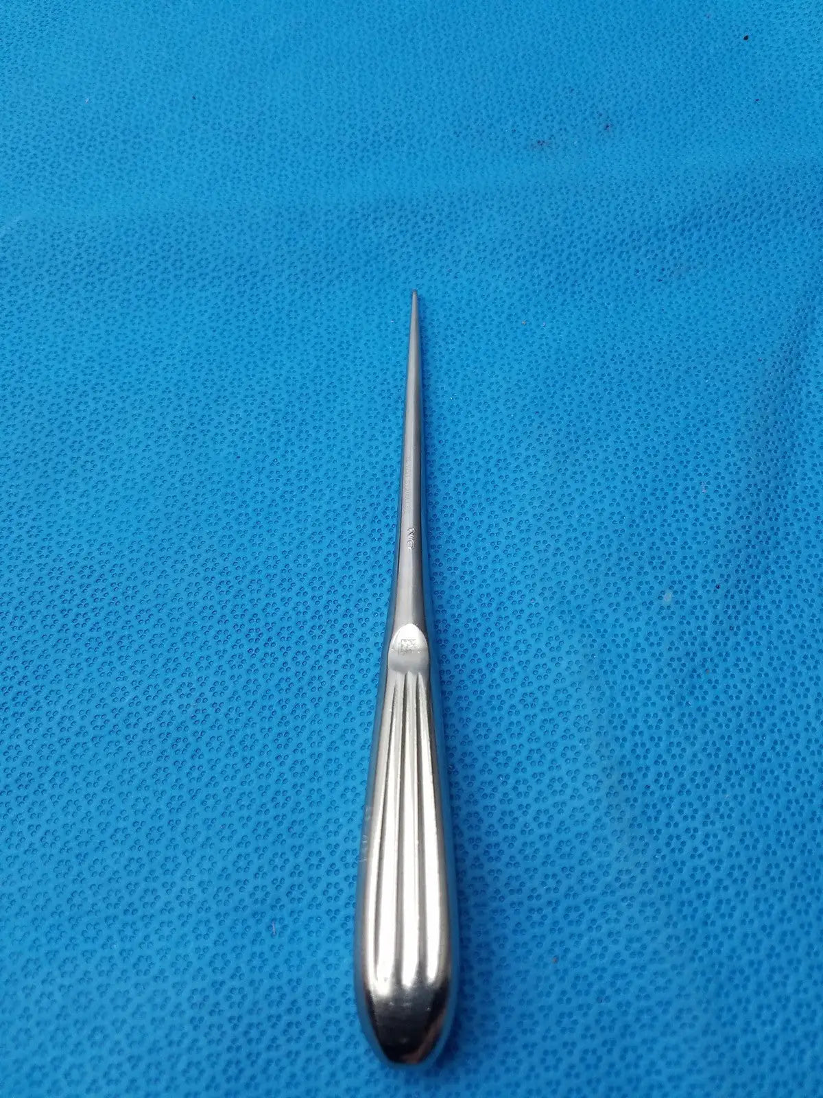 Silver spratt bone curette stainless surgical instrument with slender pointed tip and ribbed handle for orthopedic use