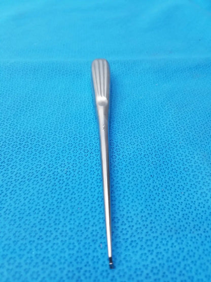 A sleek stainless bone curette spratt bone curette with ribbed handle and tapered shaft for surgical orthopedic use