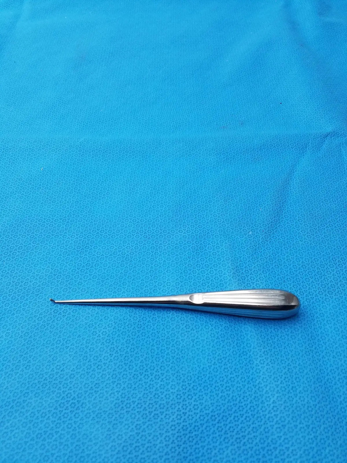 Stainless steel spratt bone curette with polished elongated handle and curved tip for surgical orthopedic use