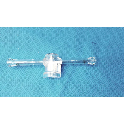 Clear plastic borosilicate lab adapter with central hub and two arms featuring glass stopcock valve for vacuum use