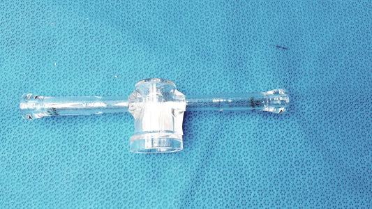 Clear plastic borosilicate lab adapter with central hub and two arms featuring glass stopcock valve for vacuum use