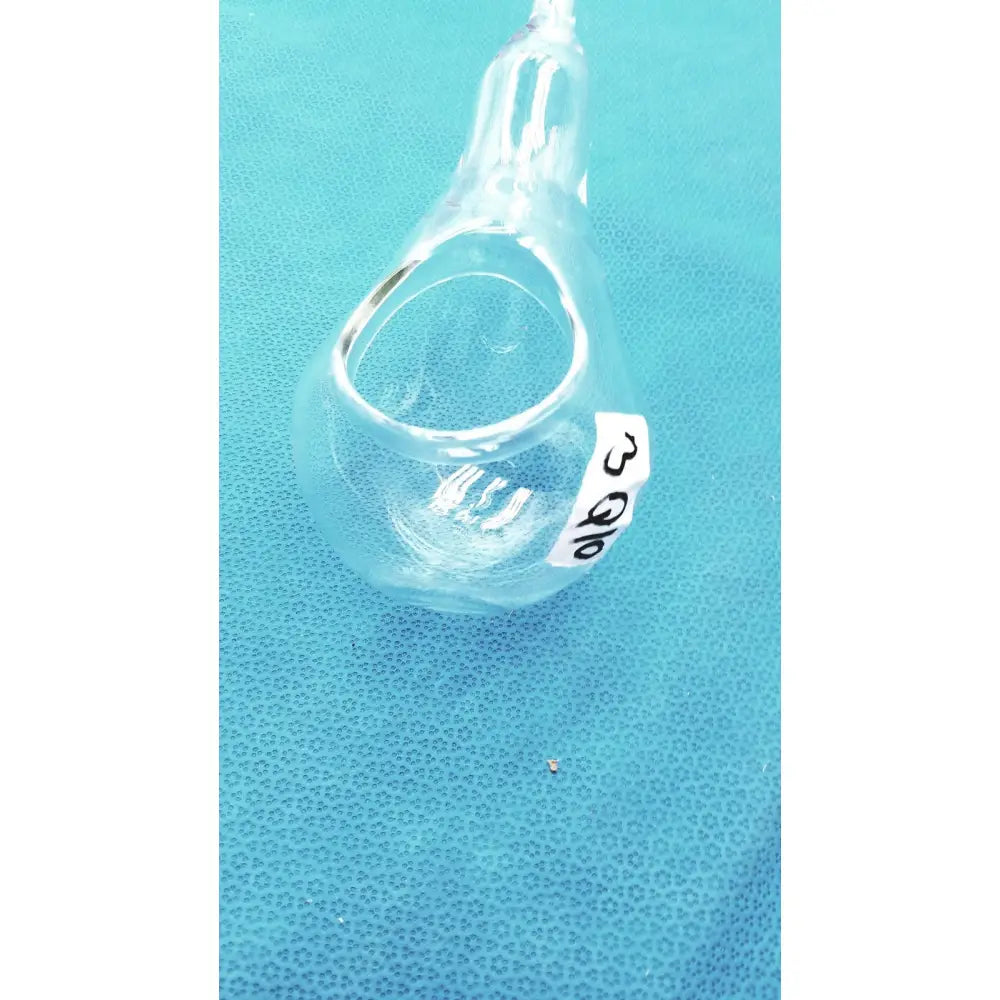 Clear glass 24/40 glassware adapter with white label connecting a 90° cone to rubber hose tube inlet joint