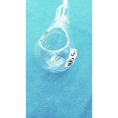 Clear glass 24/40 glassware adapter with white label connecting a 90° cone to rubber hose tube inlet joint