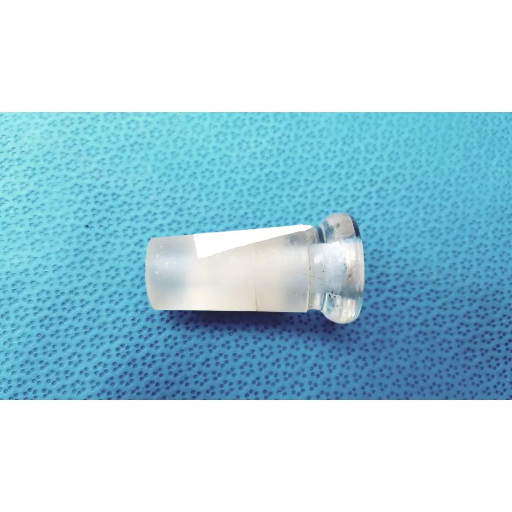 Clear plastic vape cartridge with metallic threaded base shown with high-quality borosilicate glass lab glass adapter