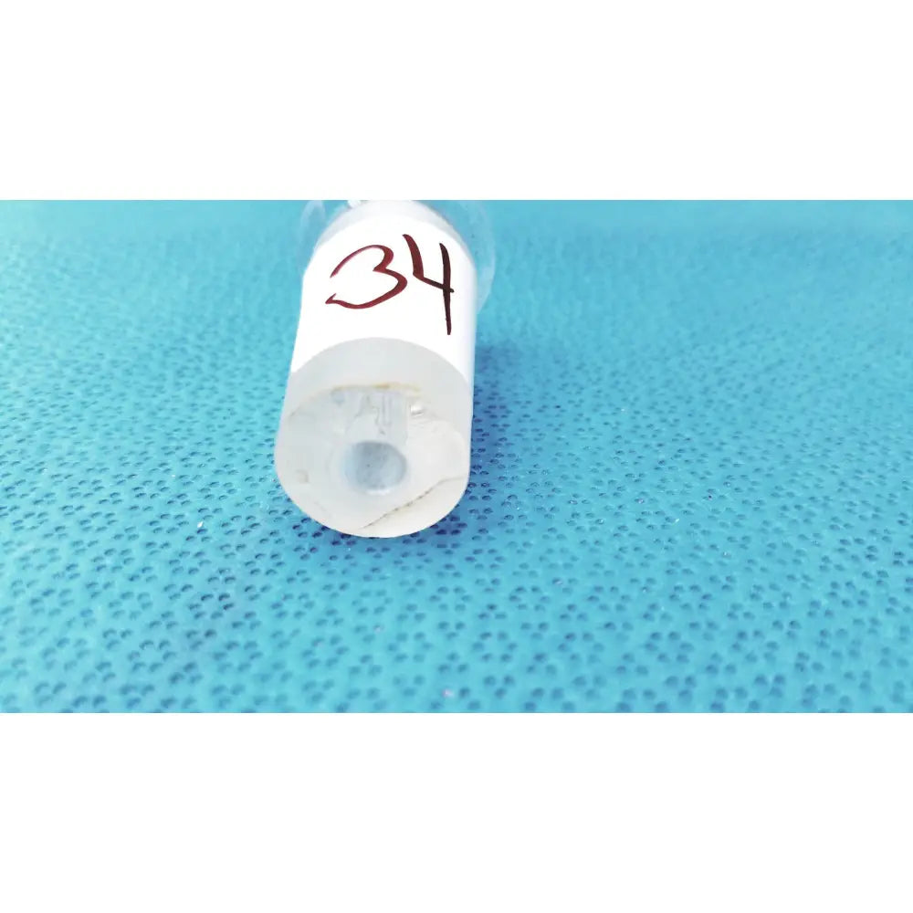 Clear plastic syringe with white label 34 paired with a 24/40 high-quality borosilicate lab glass adapter connector
