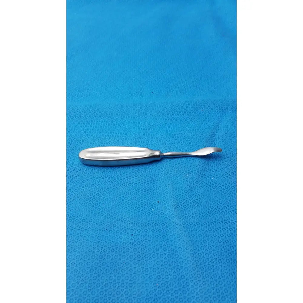 Silver surgical instrument 2977-01 with smooth elongated handle and curved tapered tip chandler bone elevators large bone elevators